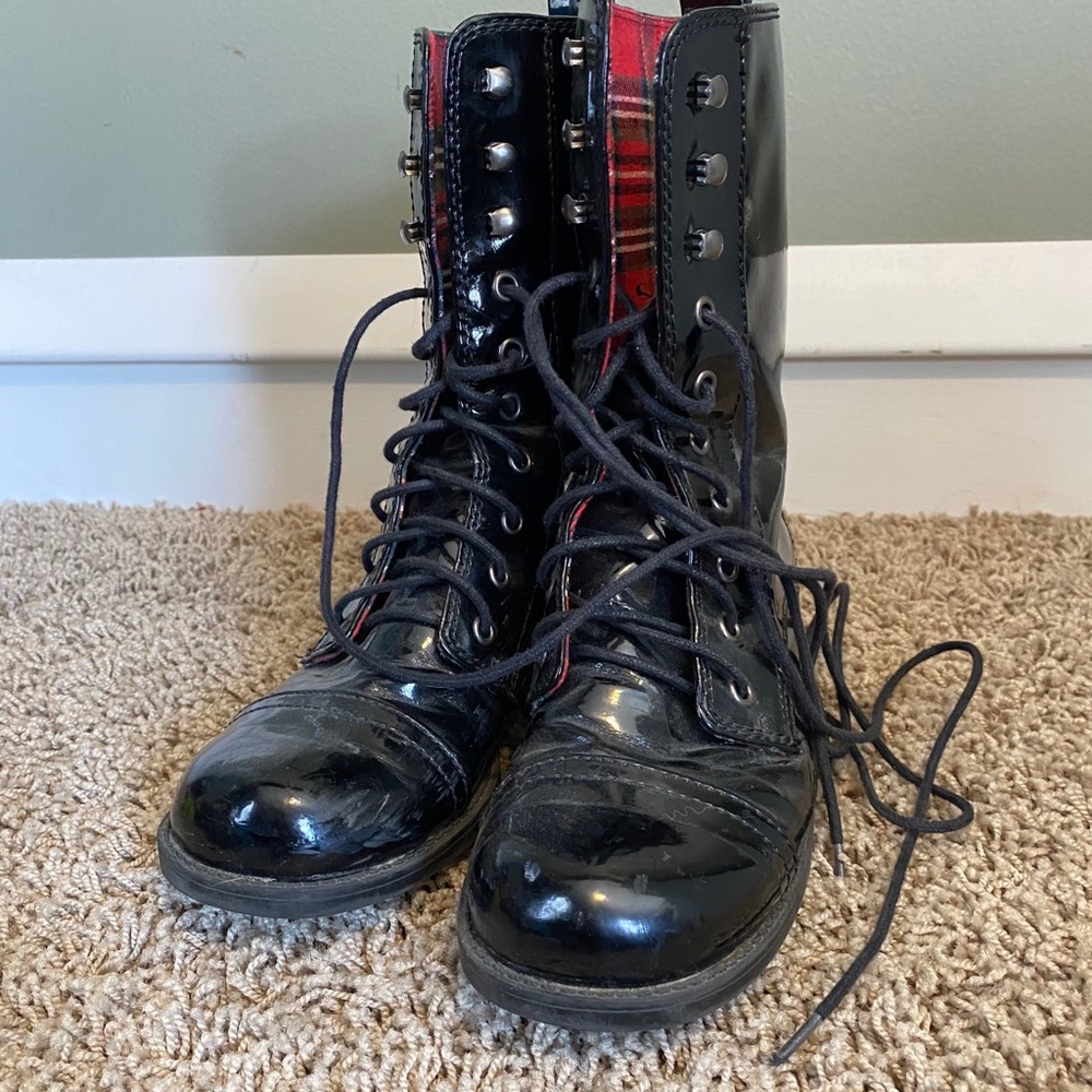 Tall lace up boots with red plaid interior